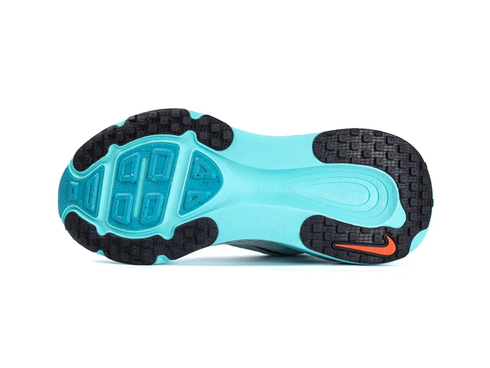 Turquoise rubber sneaker sole with black treads and orange logo accent.
