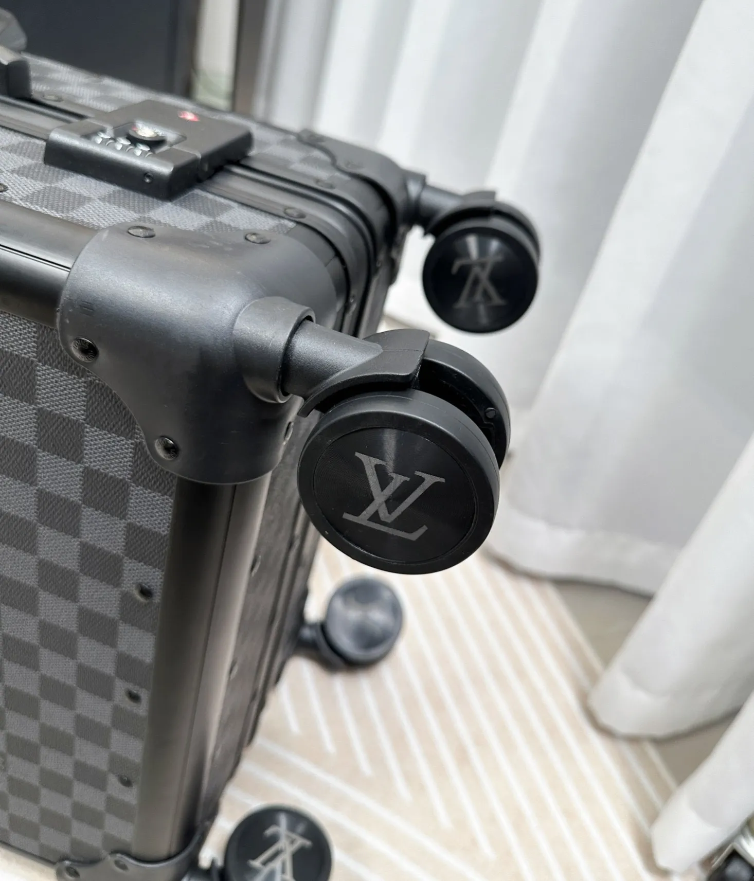 Damier Graphite luggage spinner wheel detail