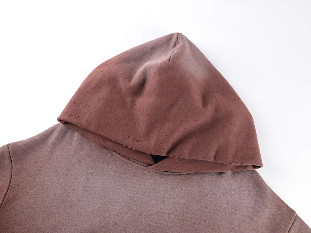Brown fabric hoodie, cotton material, showing upper part with hood detail.