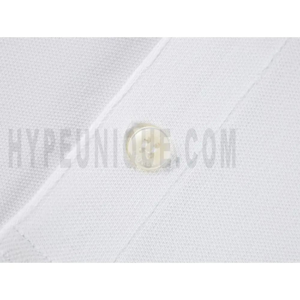 Close-up of button detail on the garment