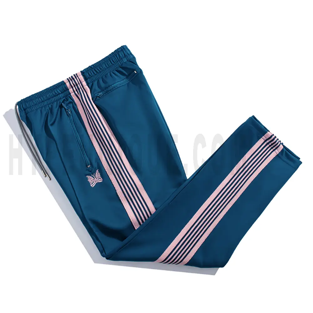 Side view of dark blue track pants.