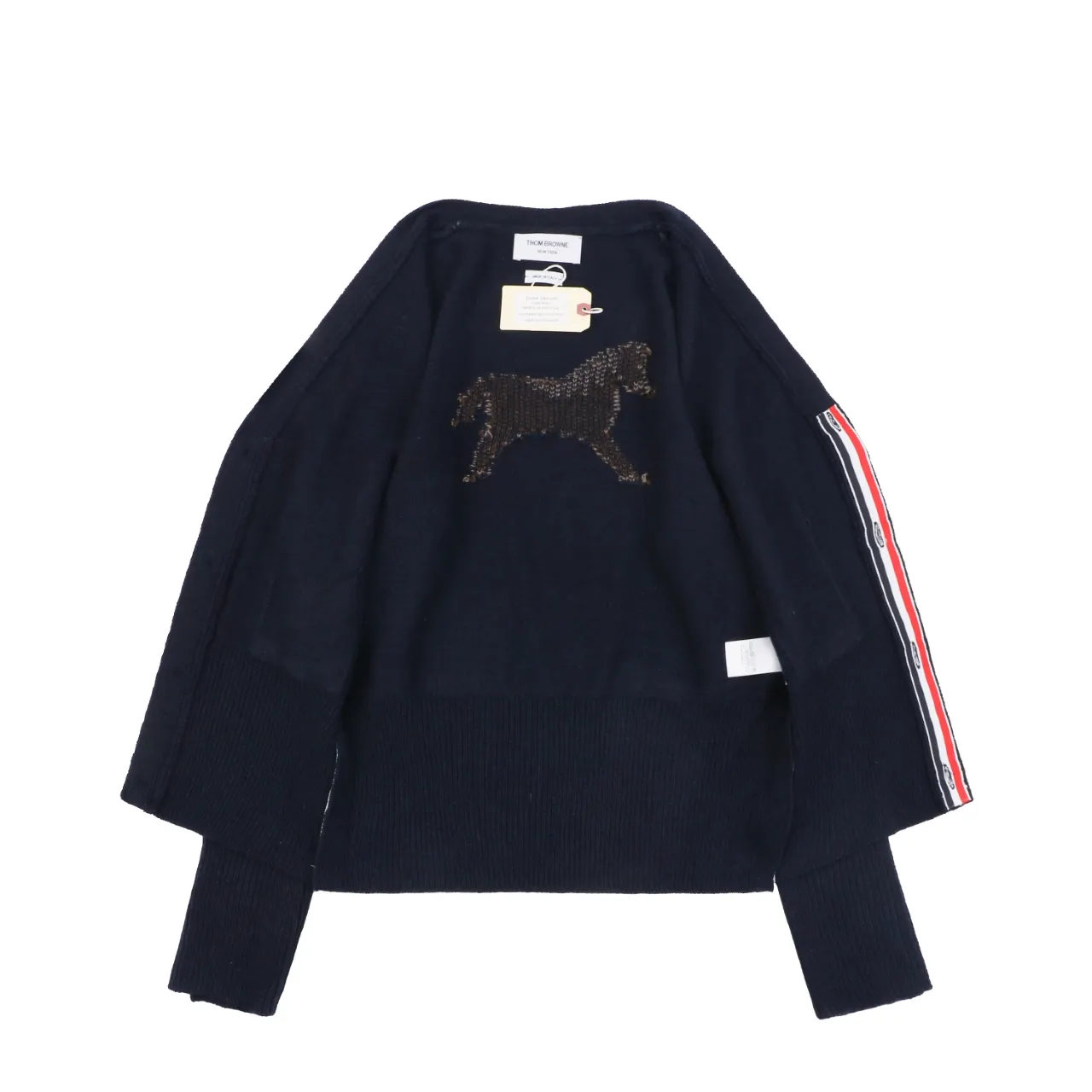 Back view of navy knit cardigan with horse graphic and stripe sleeve detail.