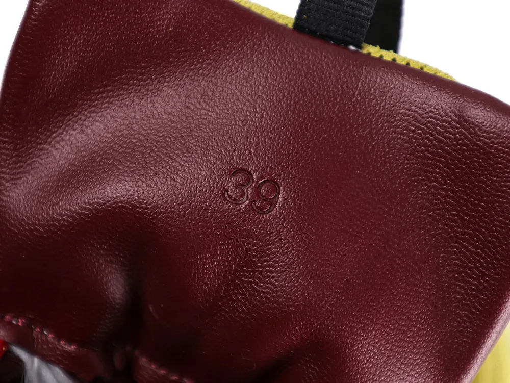 Maroon leather bag with embossed number 39, featuring a contrasting black strap.