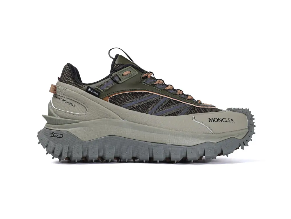 The image shows a brown sneaker sole with intricate patterns and grey edges, highlighting tread details and texture.