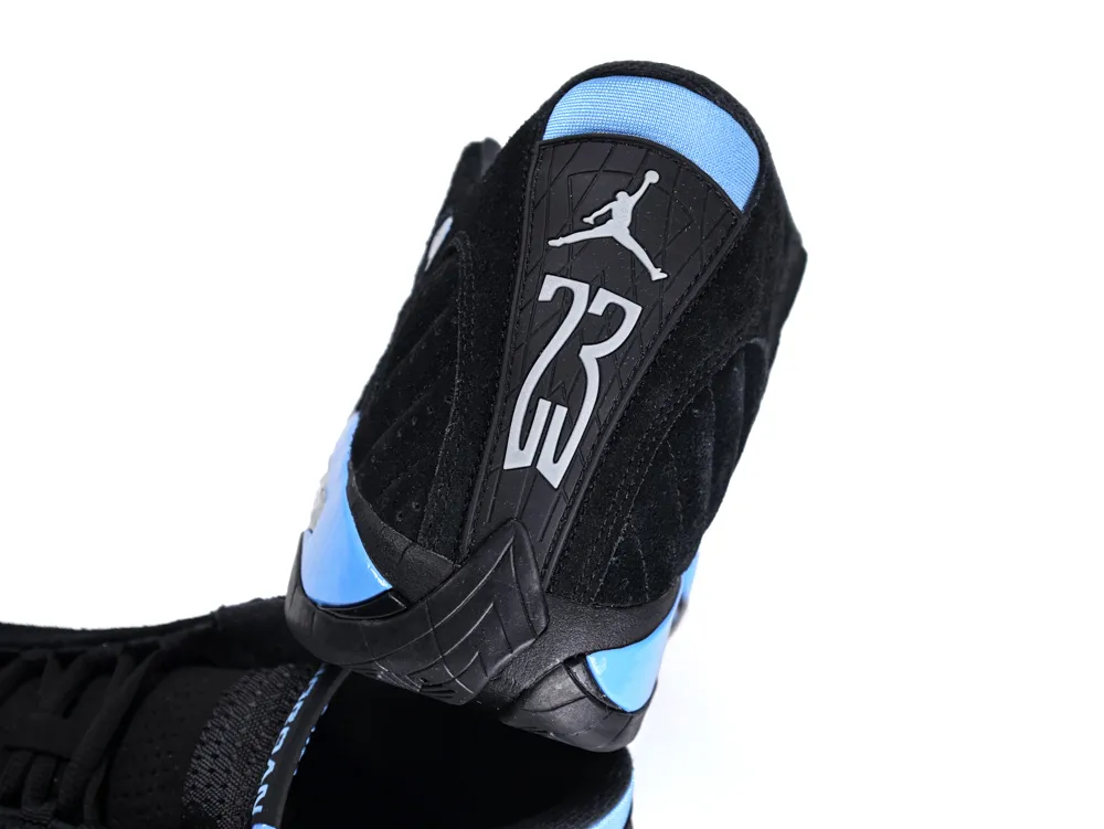 Black suede sneaker heel with blue accents and embossed numbers.