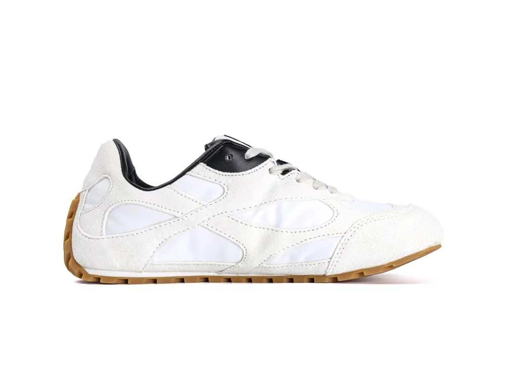 White and black sneaker with suede overlays, leather accents, and gum rubber sole.