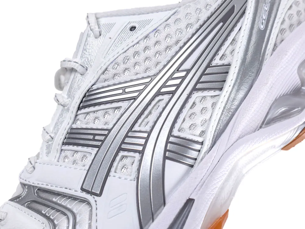 White and silver mesh sneaker with synthetic overlays and visible lacing detail.