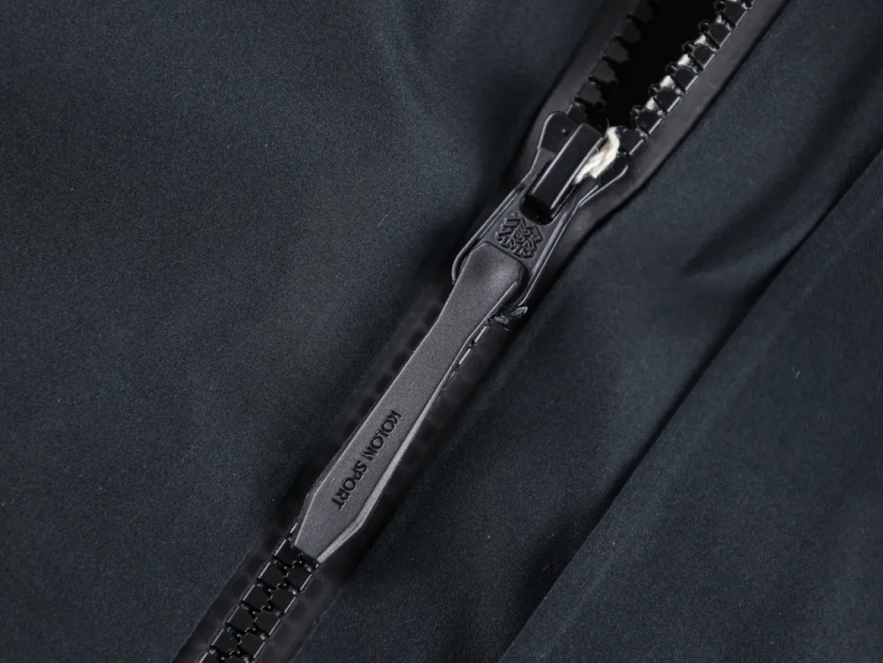 Close-up of a black metal zipper