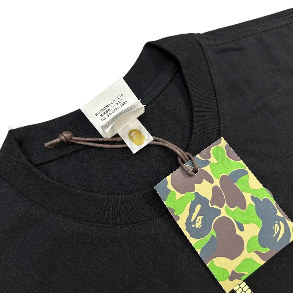 Neckline tag close-up, displaying garment care symbols and brand information with fashion-forward presentation.