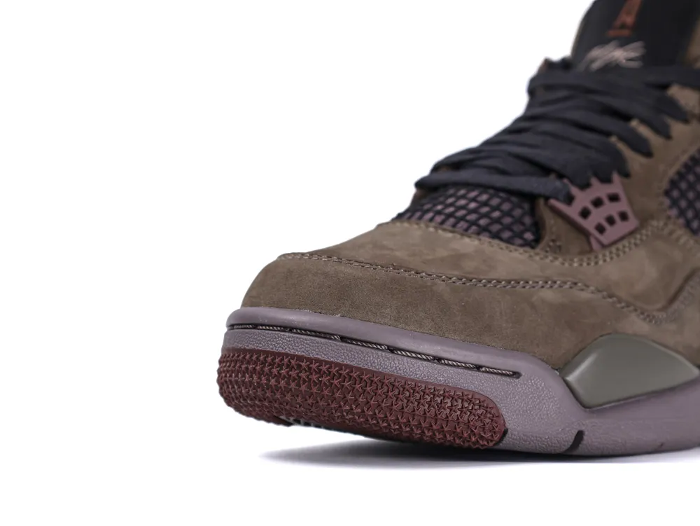 Brown suede sneaker with rubber sole and mesh accents, featuring black laces.