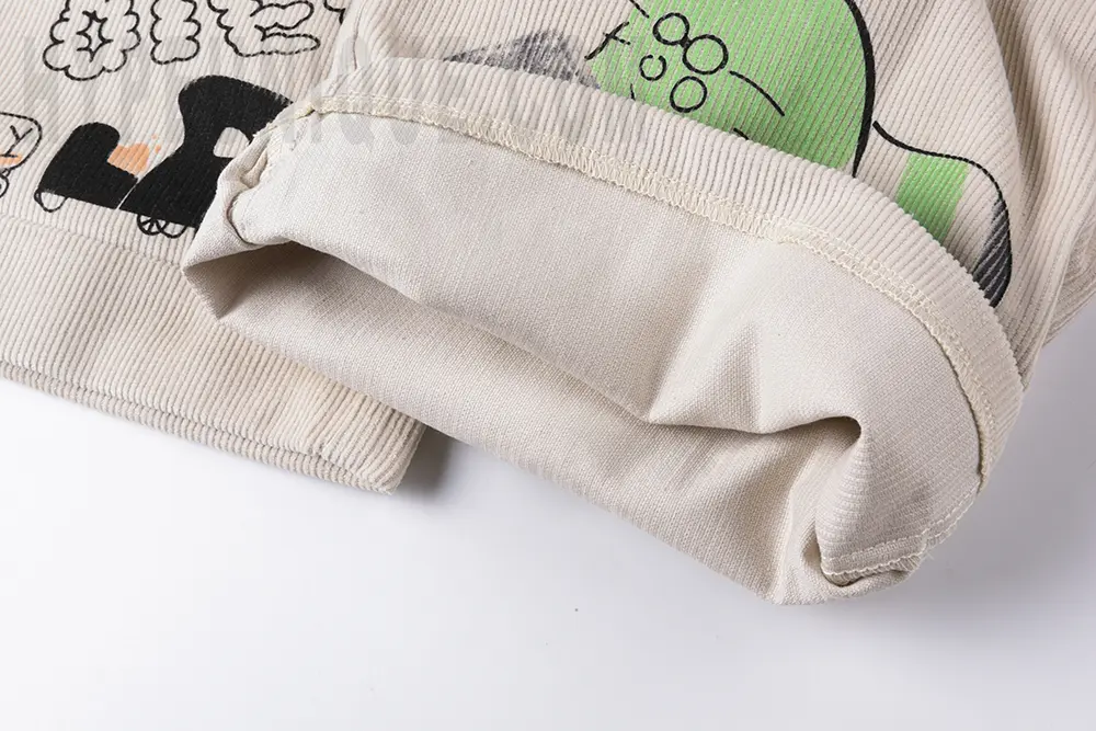 Inner fabric detail of the pant leg on the KAPITAL Ivy Wide-Leg Pleated Printed Cotton-Corduroy Trousers.
