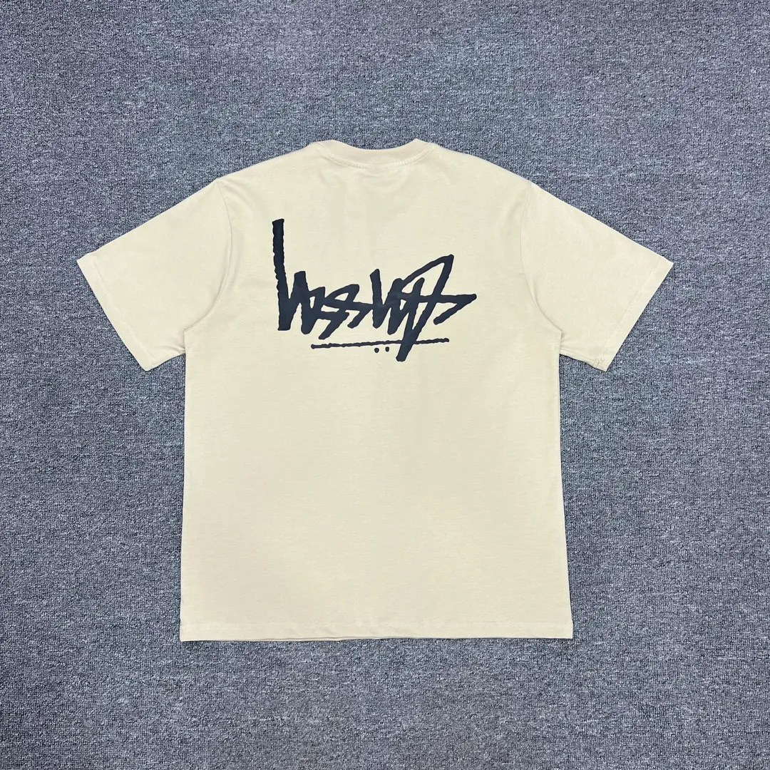 Back of Stussy Reverse Logo Print T-Shirt Color Apricot