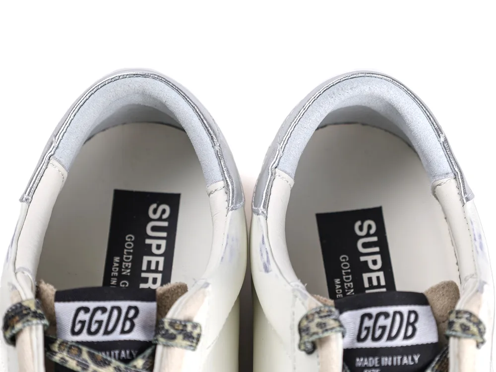 Top view of sneaker interior showing silver heel and leopard print laces