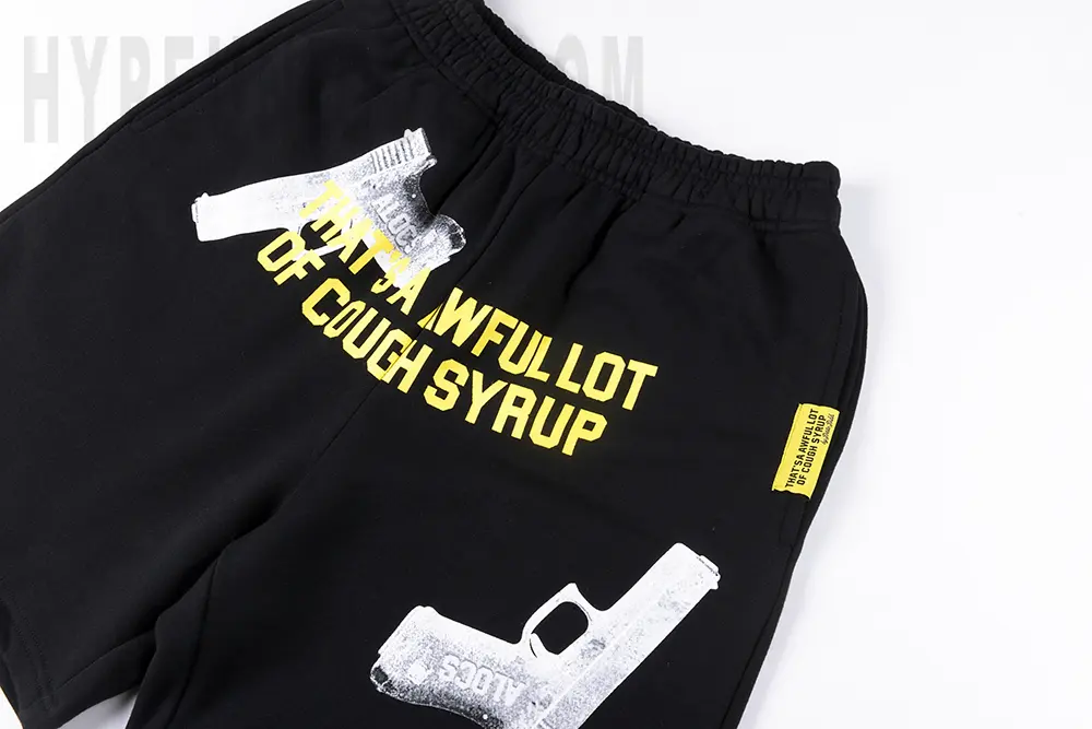 That's Awful Lot of Cough Syrup Pistol Shorts Black with branding printed on the front