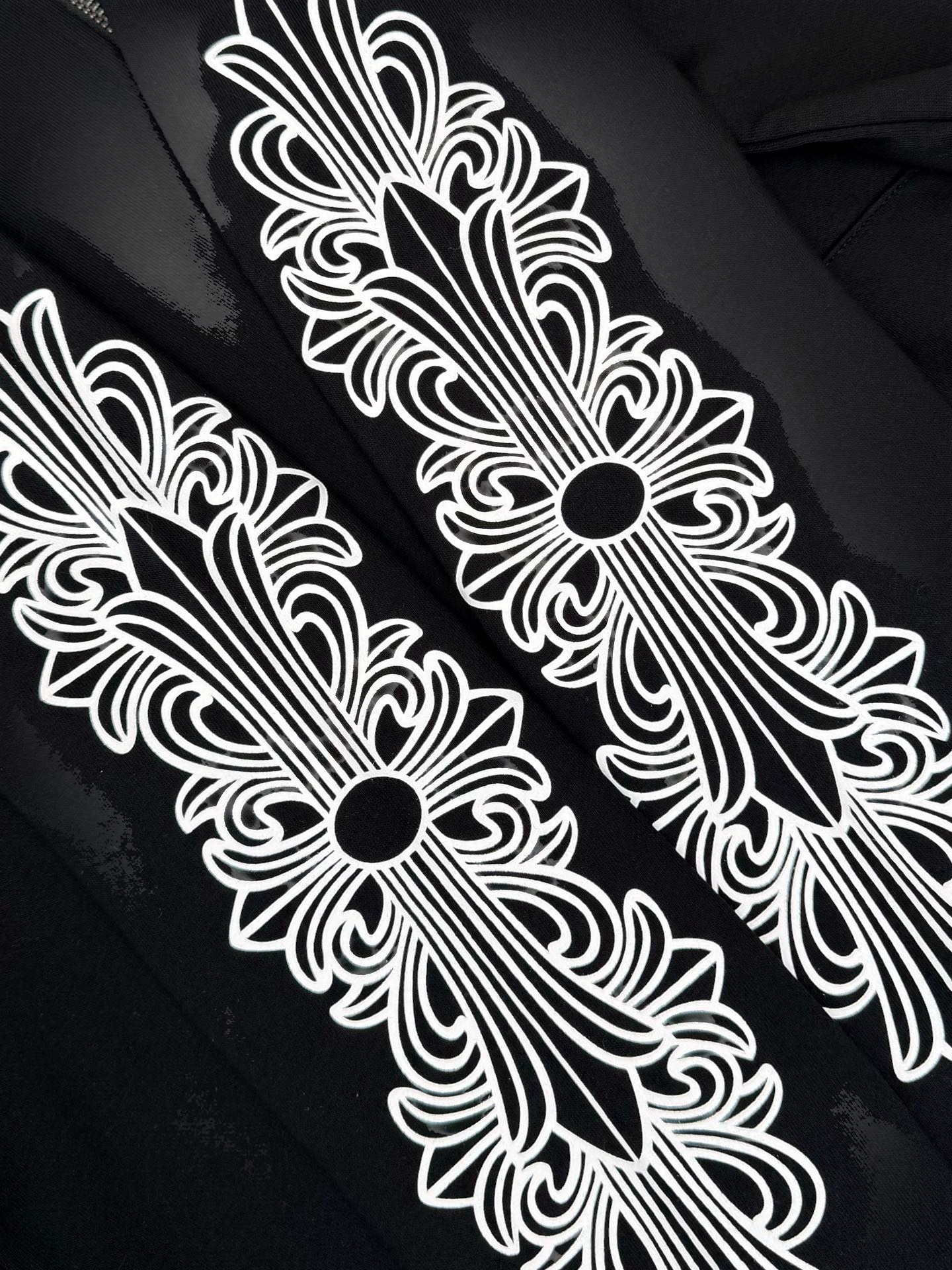 Black hoodie with floral design accents