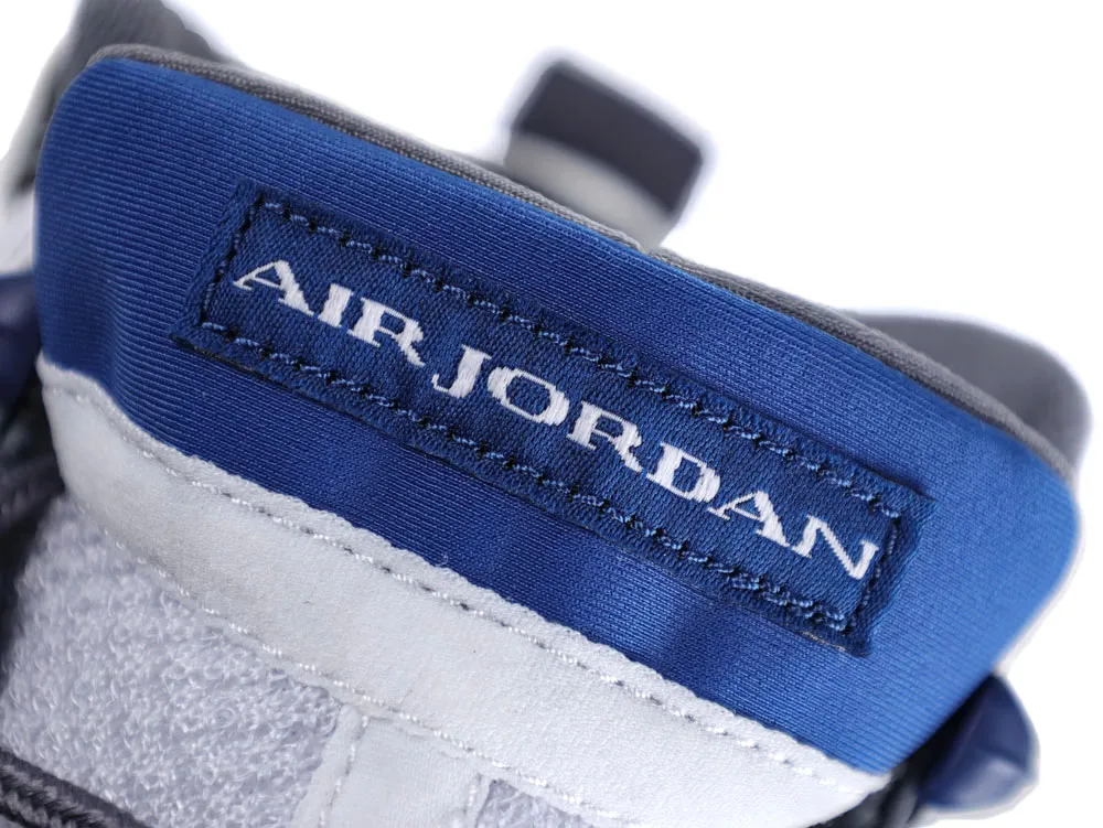 Blue and white fabric shoe label with "Air Jordan" stitching.