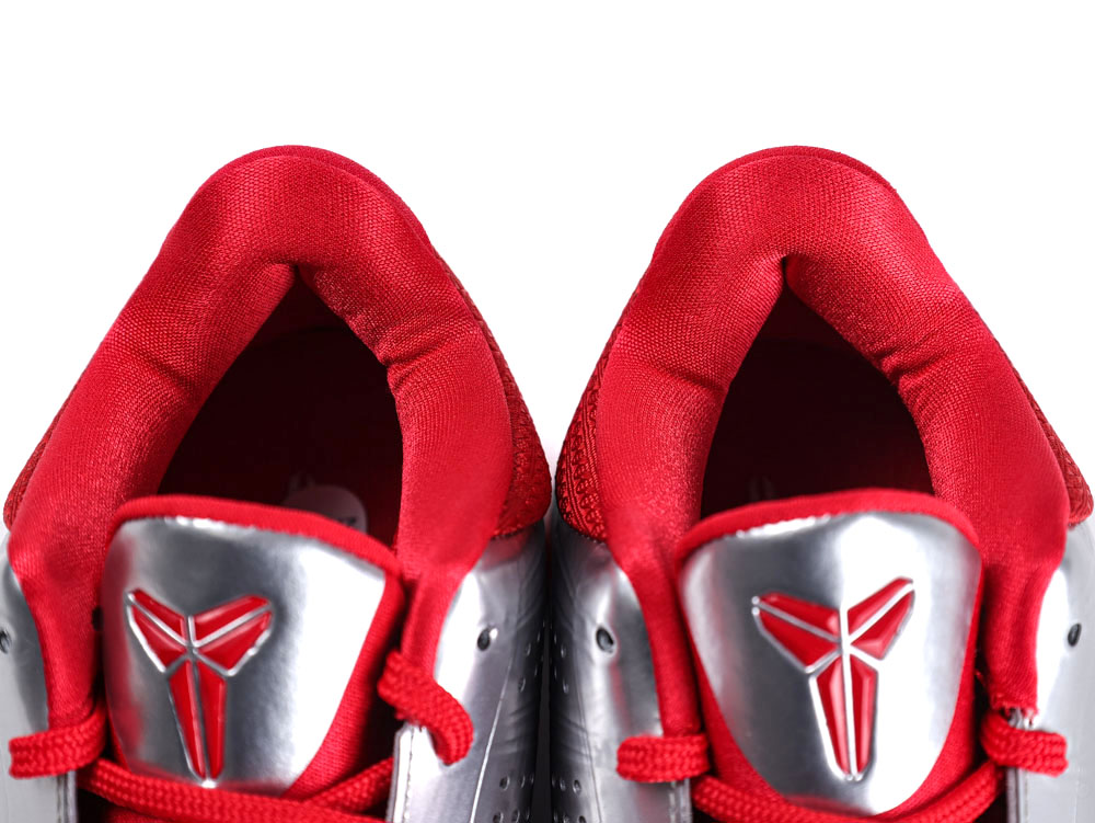 Red and silver sneakers with padded tongues and fabric lining detail.