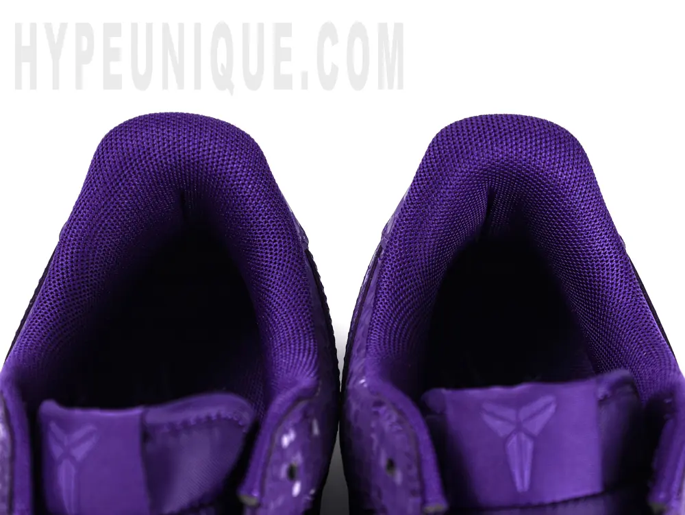 Purple Nike insoles on white background