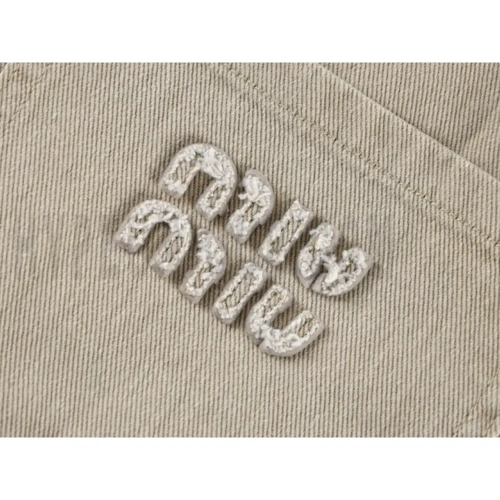 Embroidered graphic on the front of the pants
