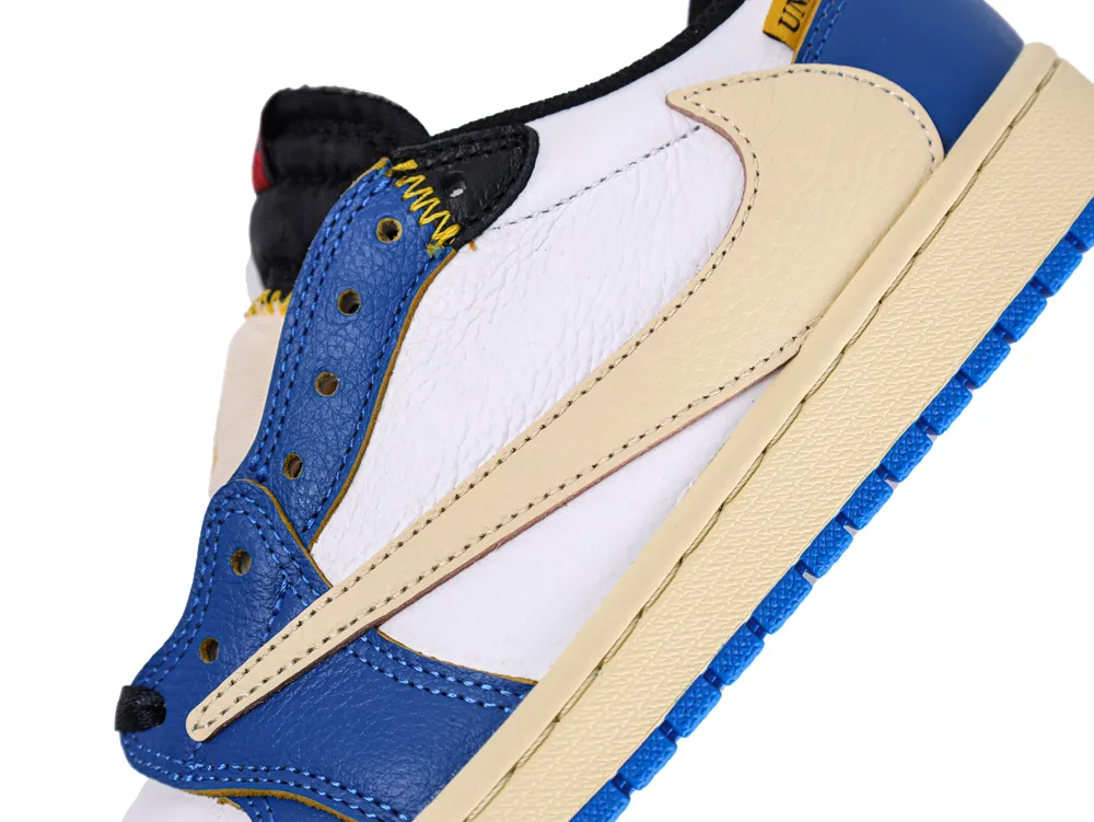 Close-up of sneaker detail with blue leather, beige swoosh, and white upper.