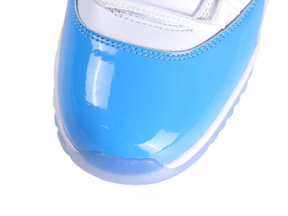 Close-up of a blue patent leather sneaker toe with white accents.