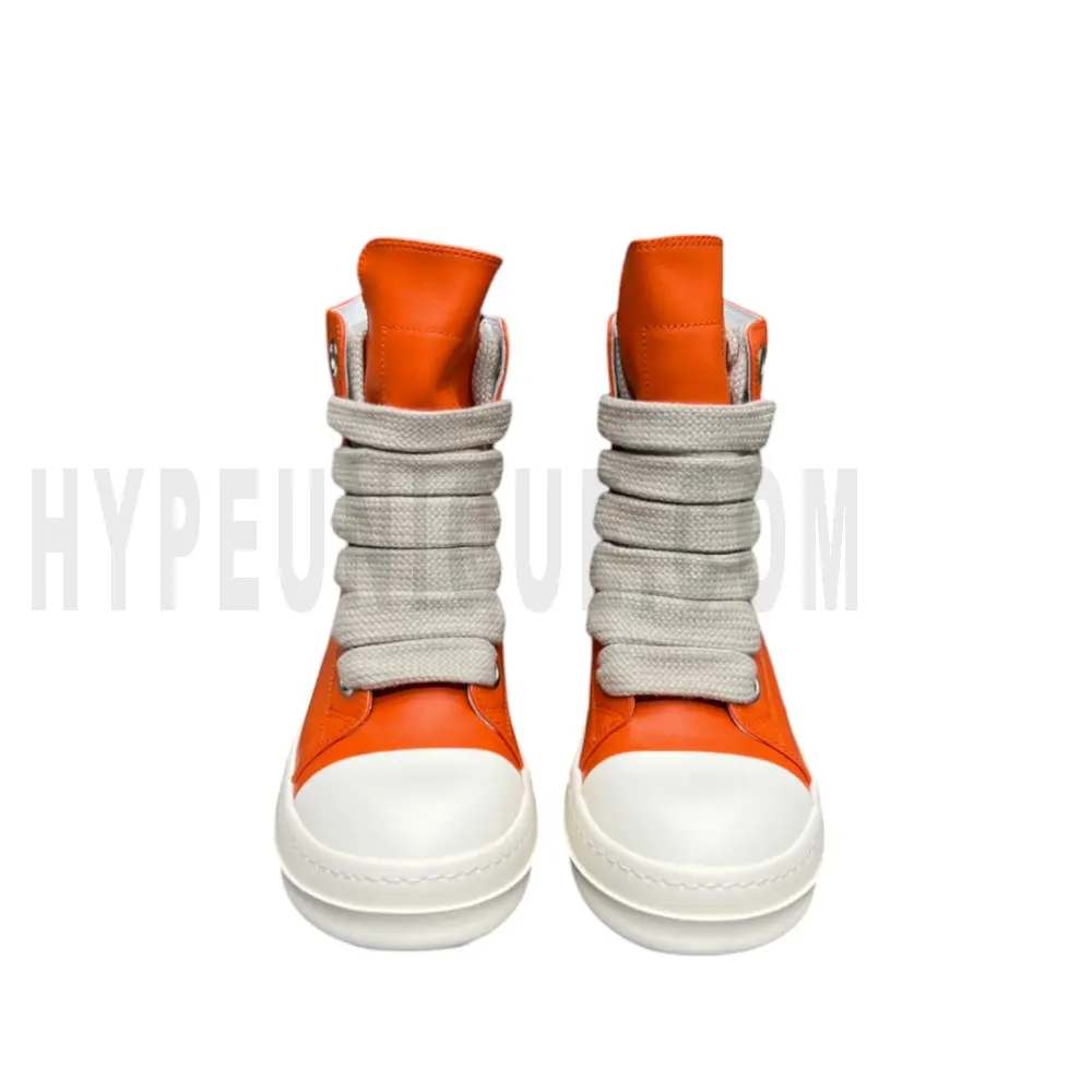 The front of the orange shoes