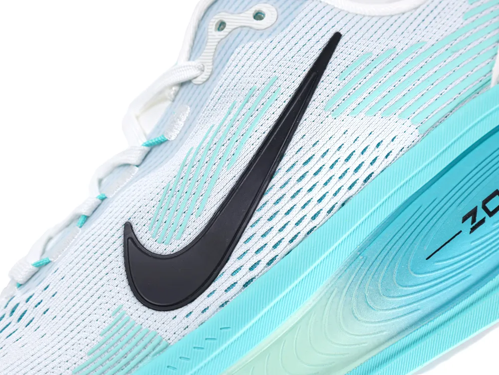 White mesh shoe with turquoise gradient sole and black logo detail.