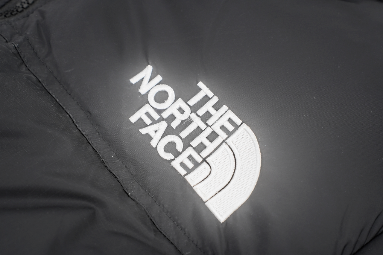 Black puffer jacket with logo