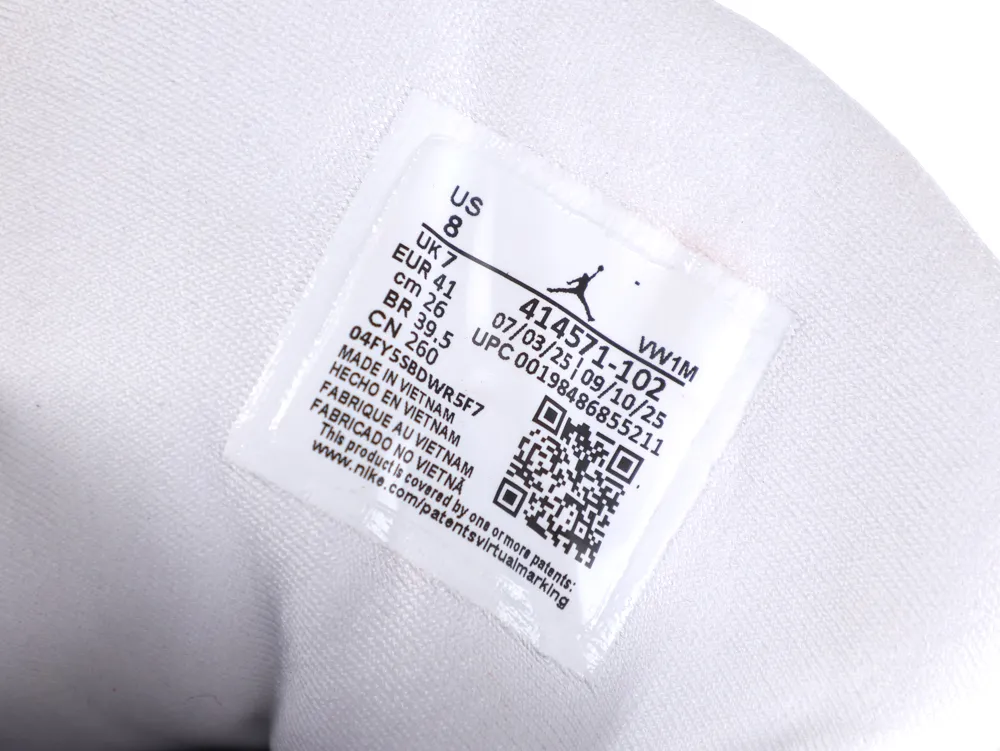 White fabric shoe label with printed size and manufacturing details.