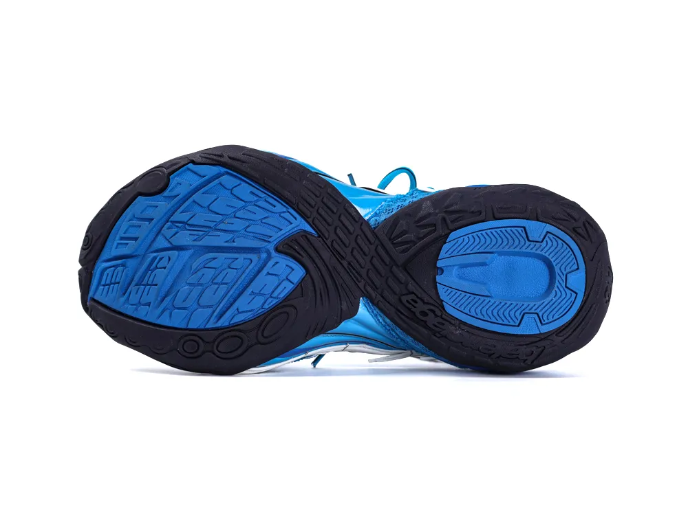 Blue and black rubber shoe sole with textured pattern for grip.
